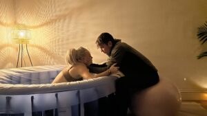 Private midwife providing intimate labor support during home birth in Sussex